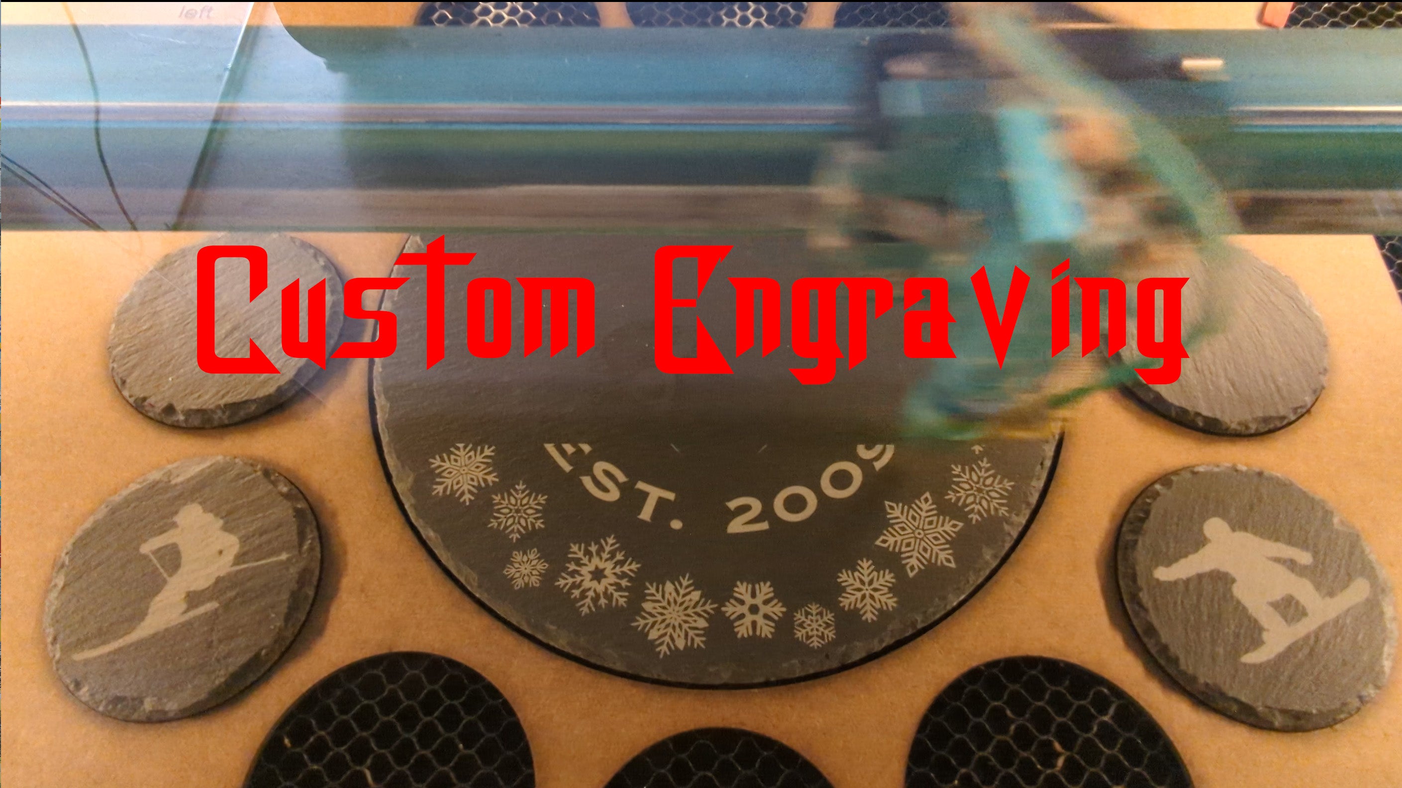 Load video: Laser engraving custom slate trivet and coasters.